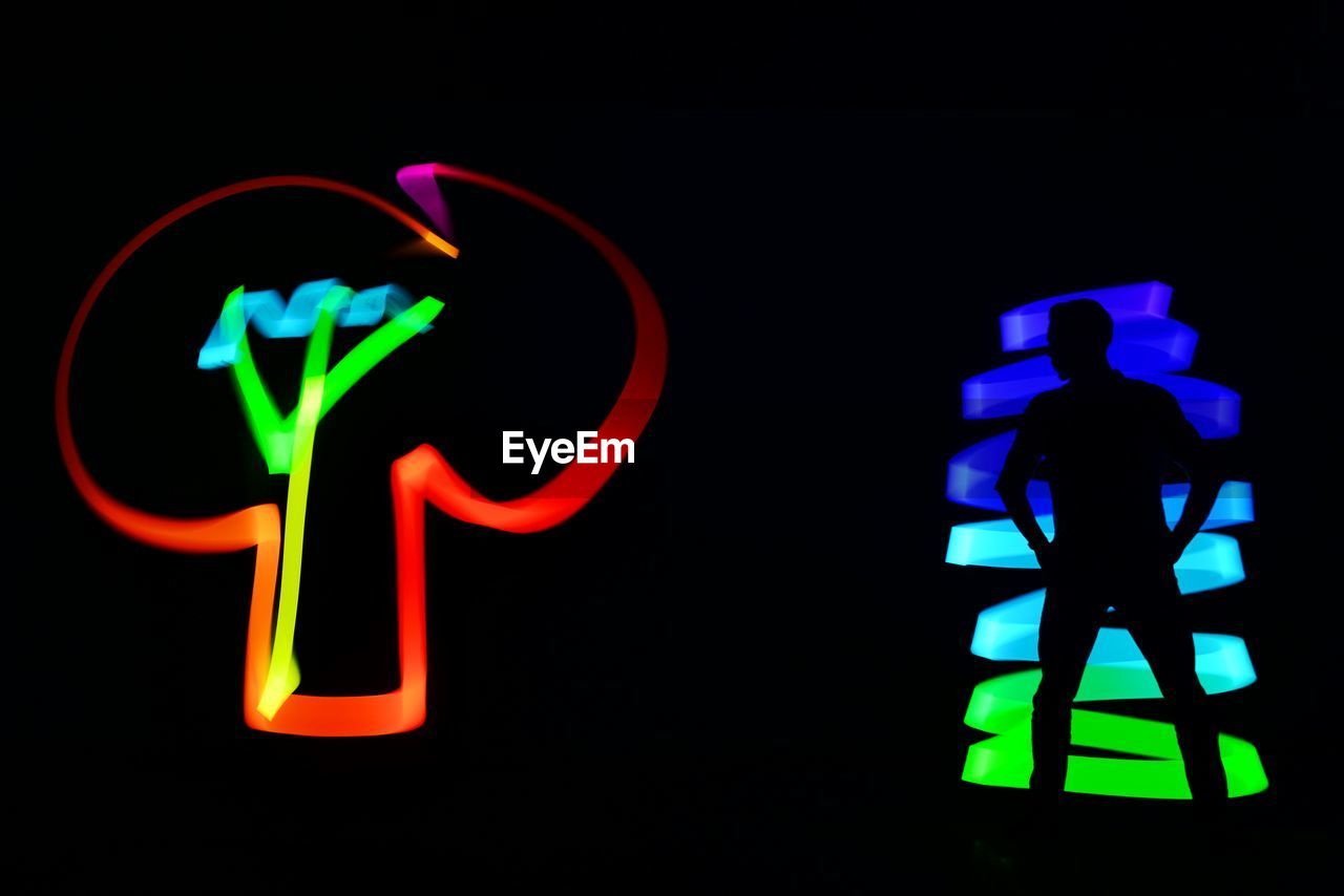 CLOSE-UP OF ILLUMINATED LIGHT PAINTING