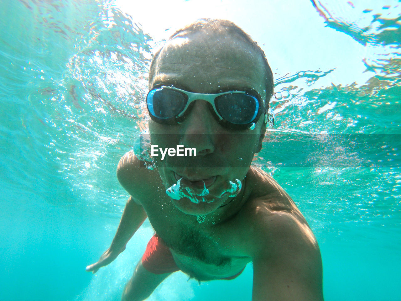 Portrait of man swimming in sea