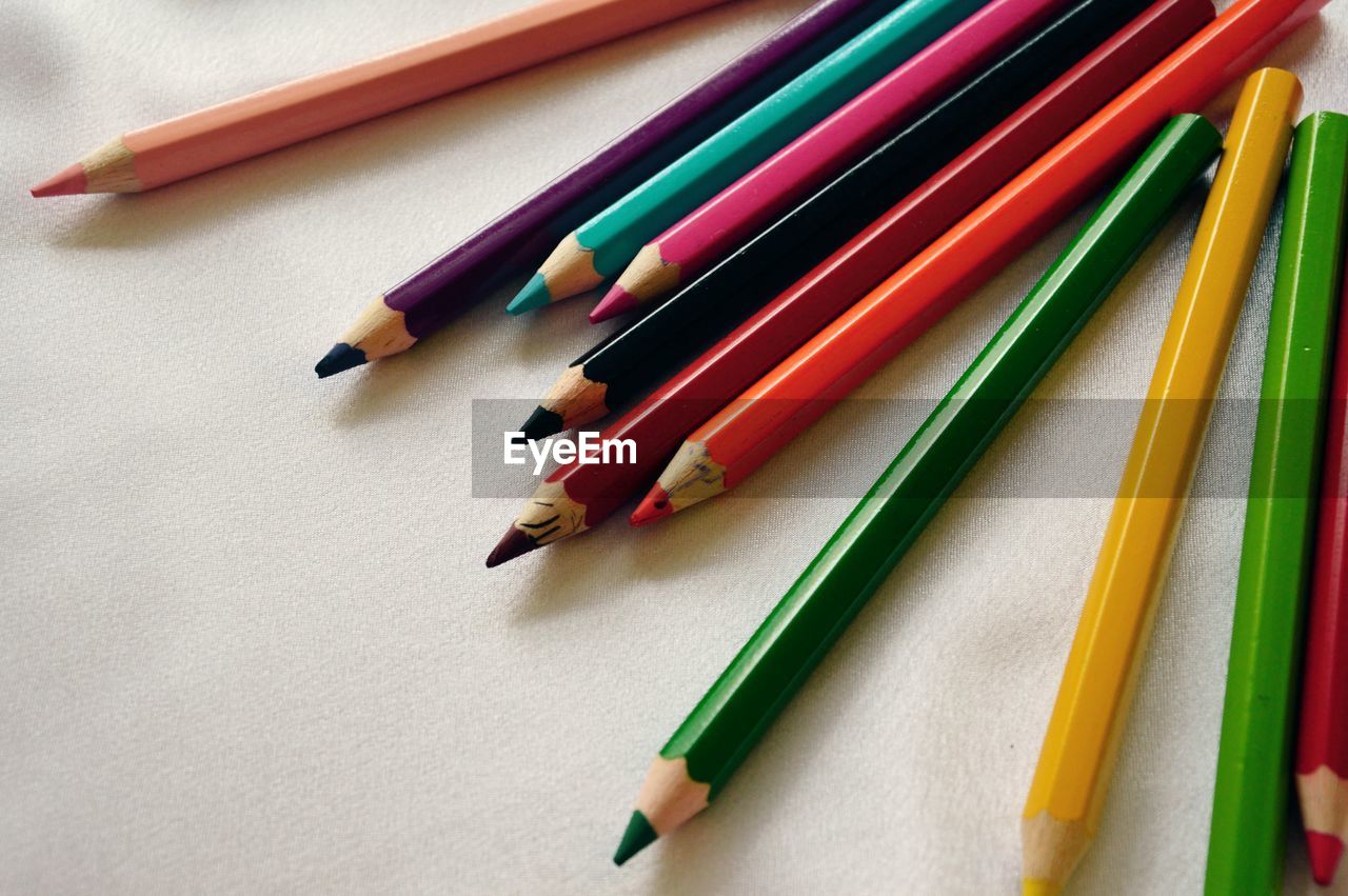 Close-up of colorful pencils on paper