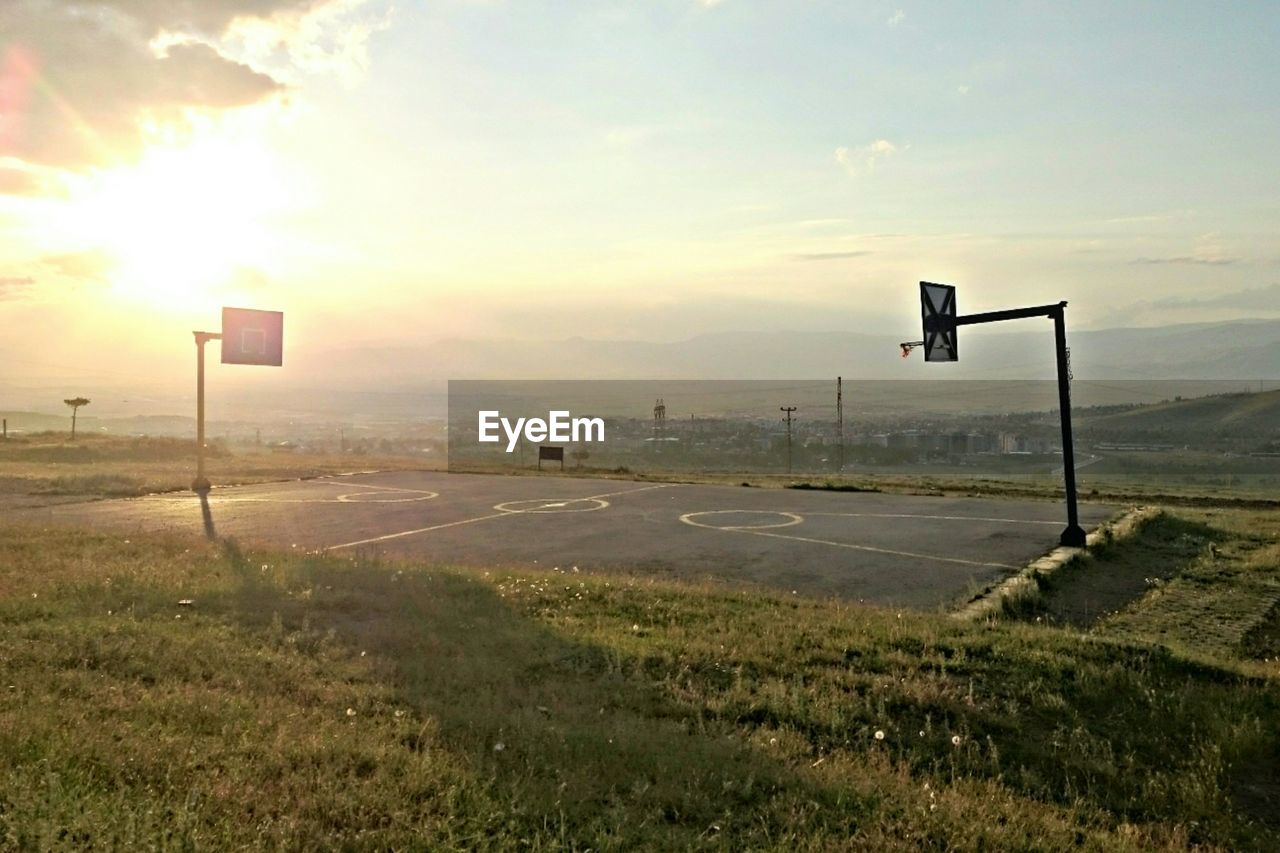 VIEW OF BASKETBALL COURT AT SUNSET