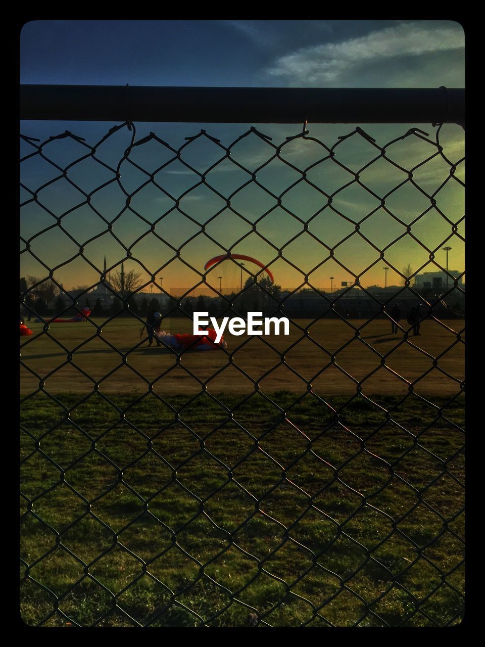 CHAINLINK FENCE SEEN THROUGH CHAINLINK FENCE