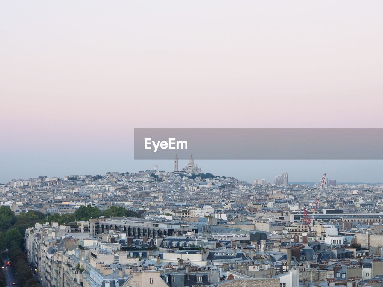 Townscape against clear sky during sunset