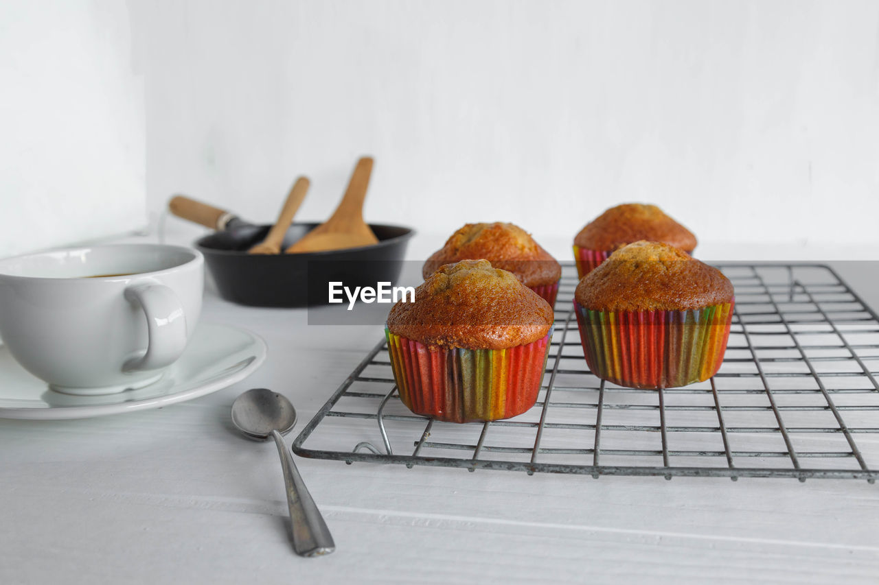 CLOSE-UP OF BREAKFAST ON TABLE AGAINST WHITE BACKGROUND