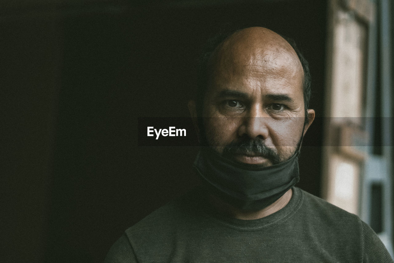 Close-up portrait of man with face mask