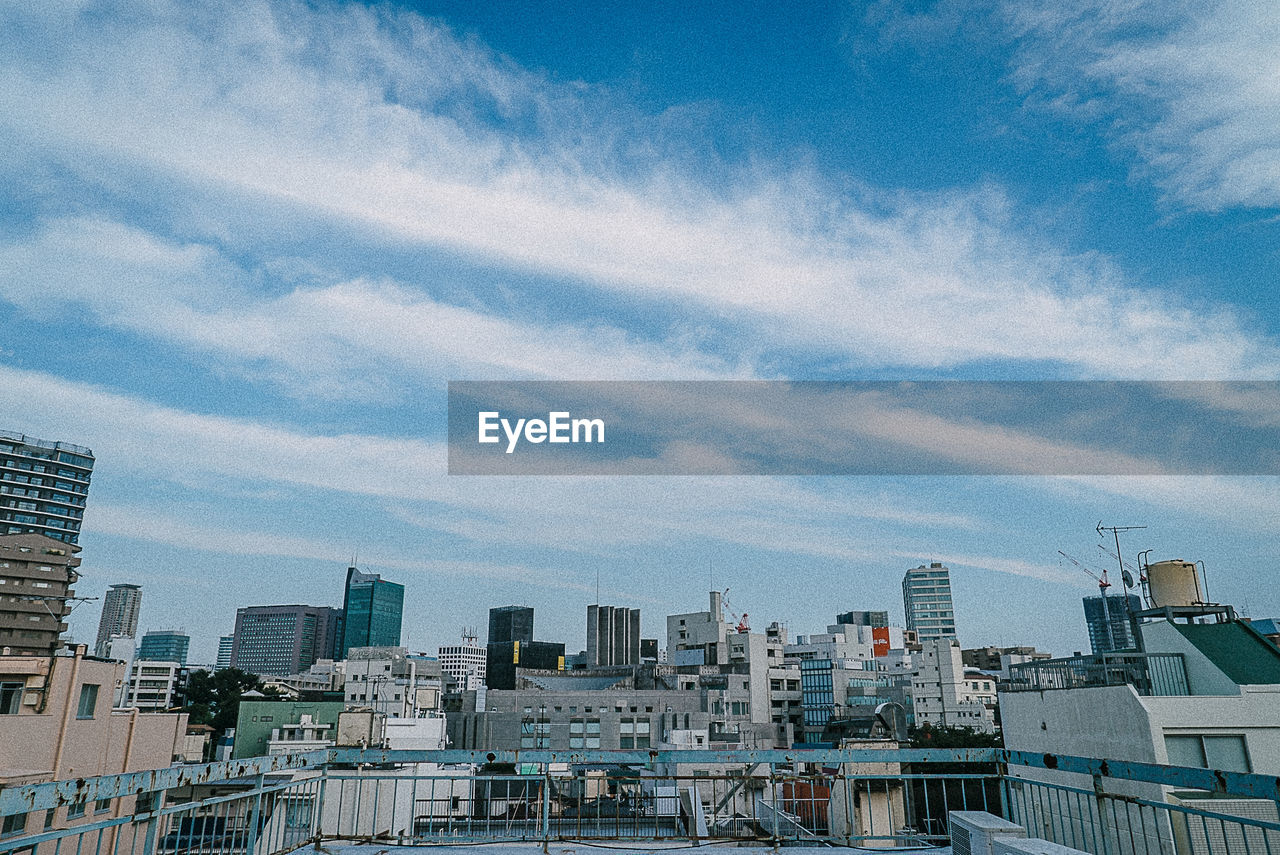 Modern buildings in city against sky