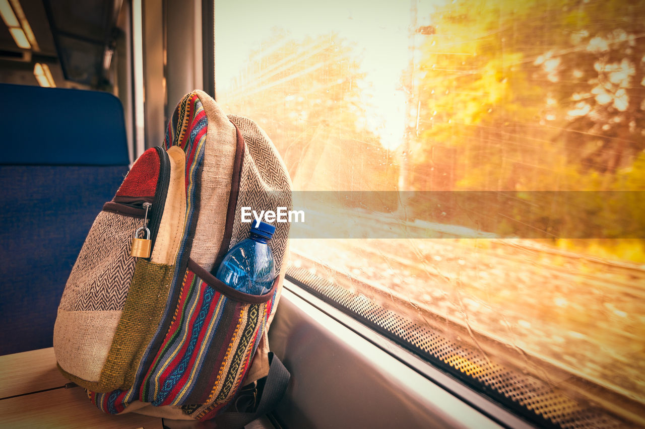 Bag on table by window in train