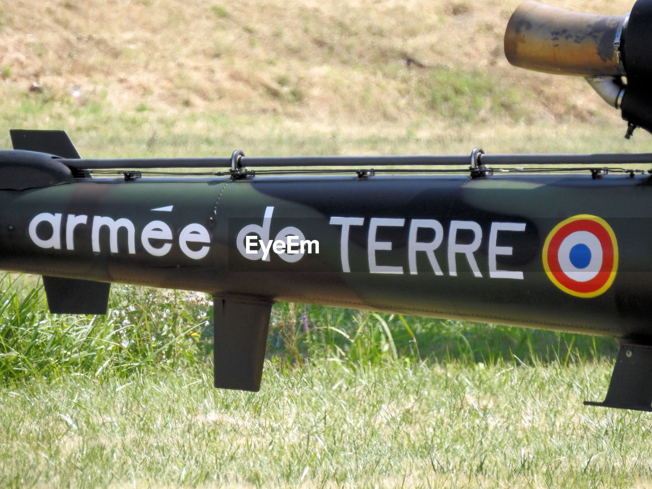 CLOSE-UP OF INFORMATION SIGN ON FIELD BY LAND