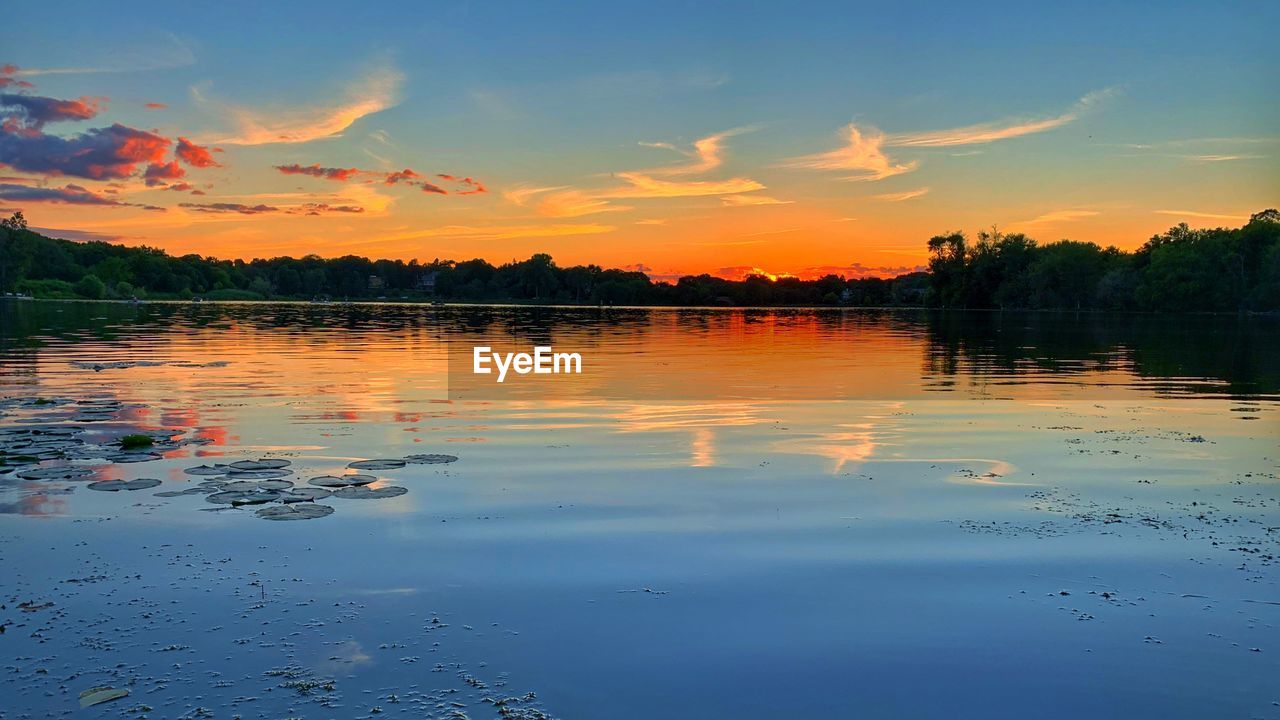 SCENIC VIEW OF LAKE DURING SUNSET