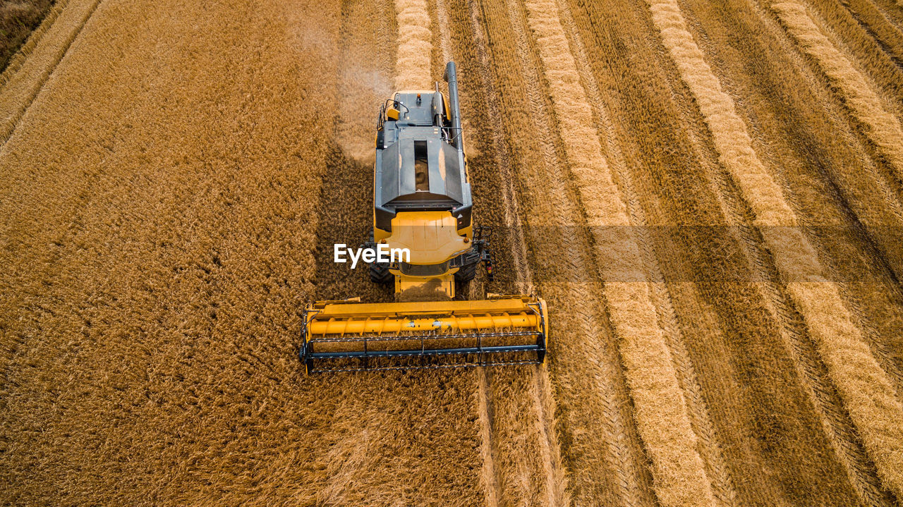 High angle view of combine harvester in field