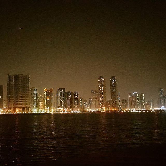 ILLUMINATED CITYSCAPE AT NIGHT