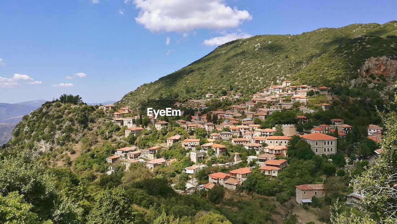 Scenic view of village on mountains