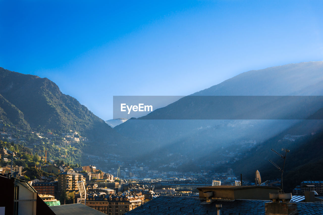 Town in the pyrenees mountains against clear blue sky