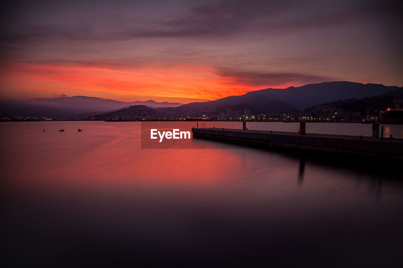 View of sea against cloudy sky during sunset