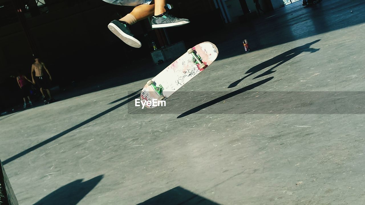 Low section of man with skateboard