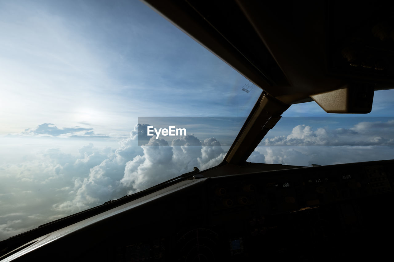 LOW ANGLE VIEW OF SKY SEEN THROUGH WINDOW