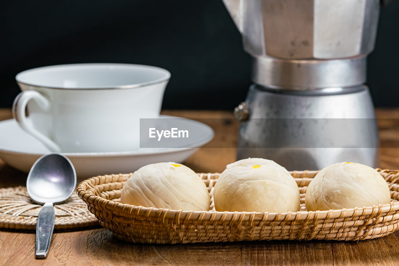 Close-up of coffee cup and cake on table