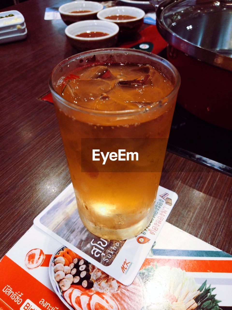 CLOSE-UP OF ICE TEA ON TABLE