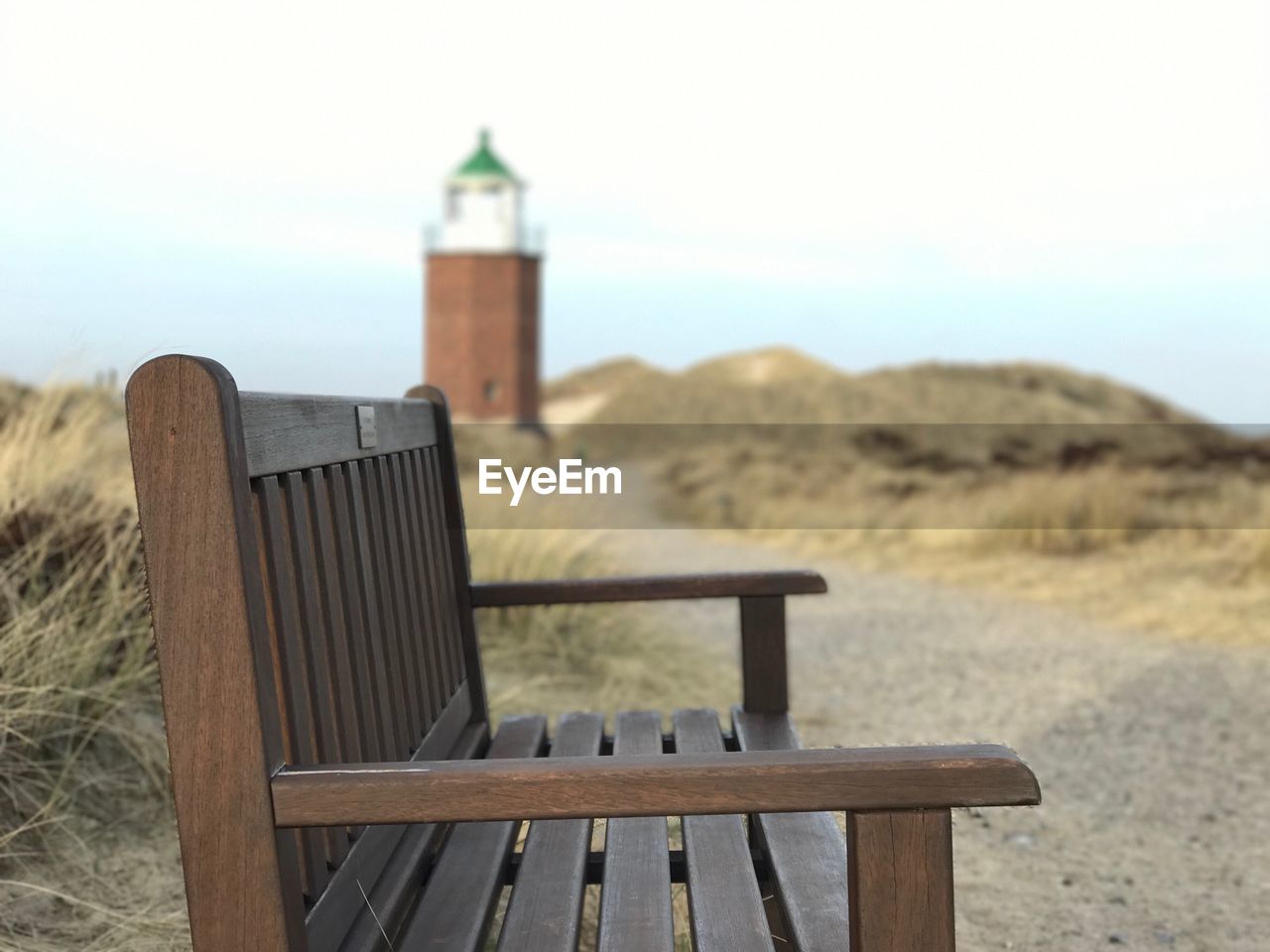 Wooden structure on beach against sky