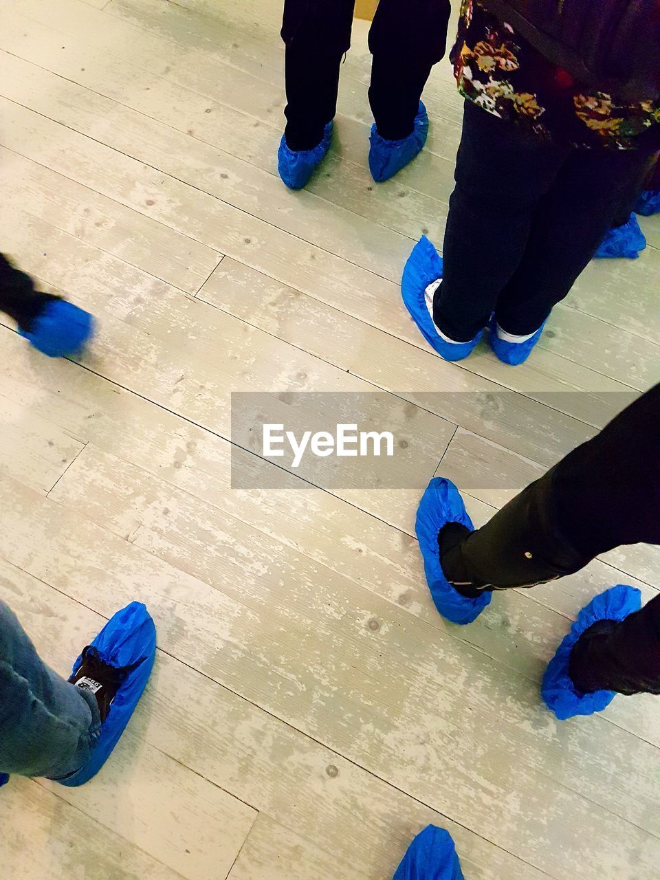 LOW SECTION OF PEOPLE STANDING ON FLOOR