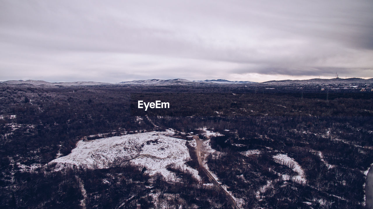 SCENIC VIEW OF LANDSCAPE AND MOUNTAINS AGAINST SKY