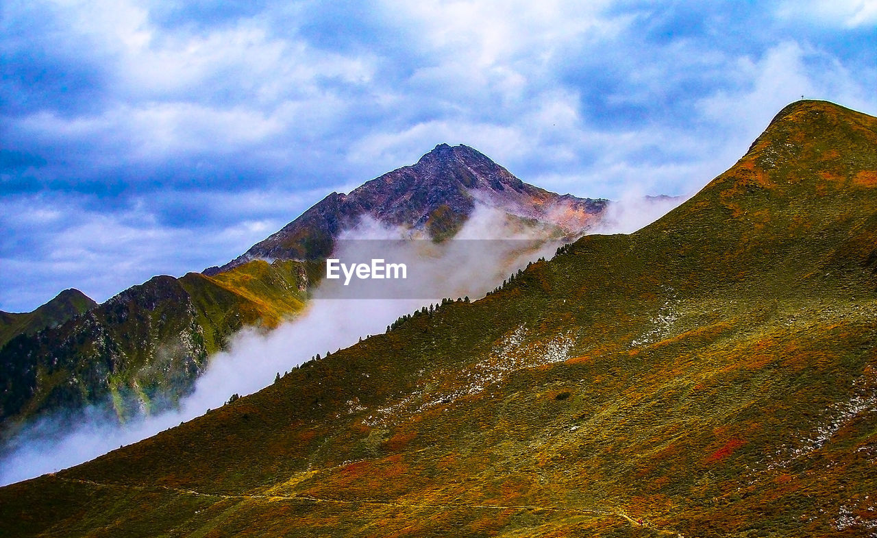 Scenic view of volcanic mountain against sky