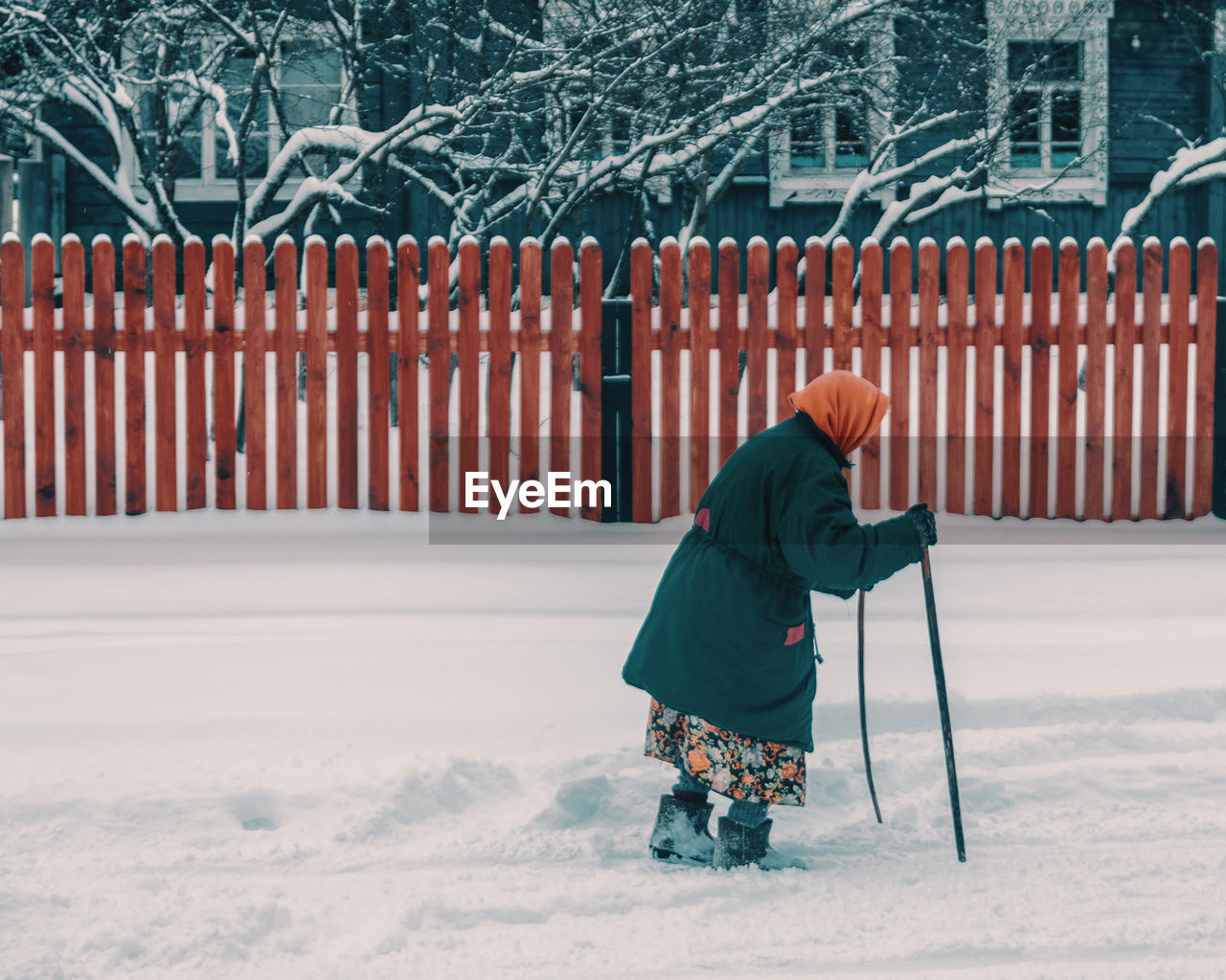 Full length of woman walking on snow