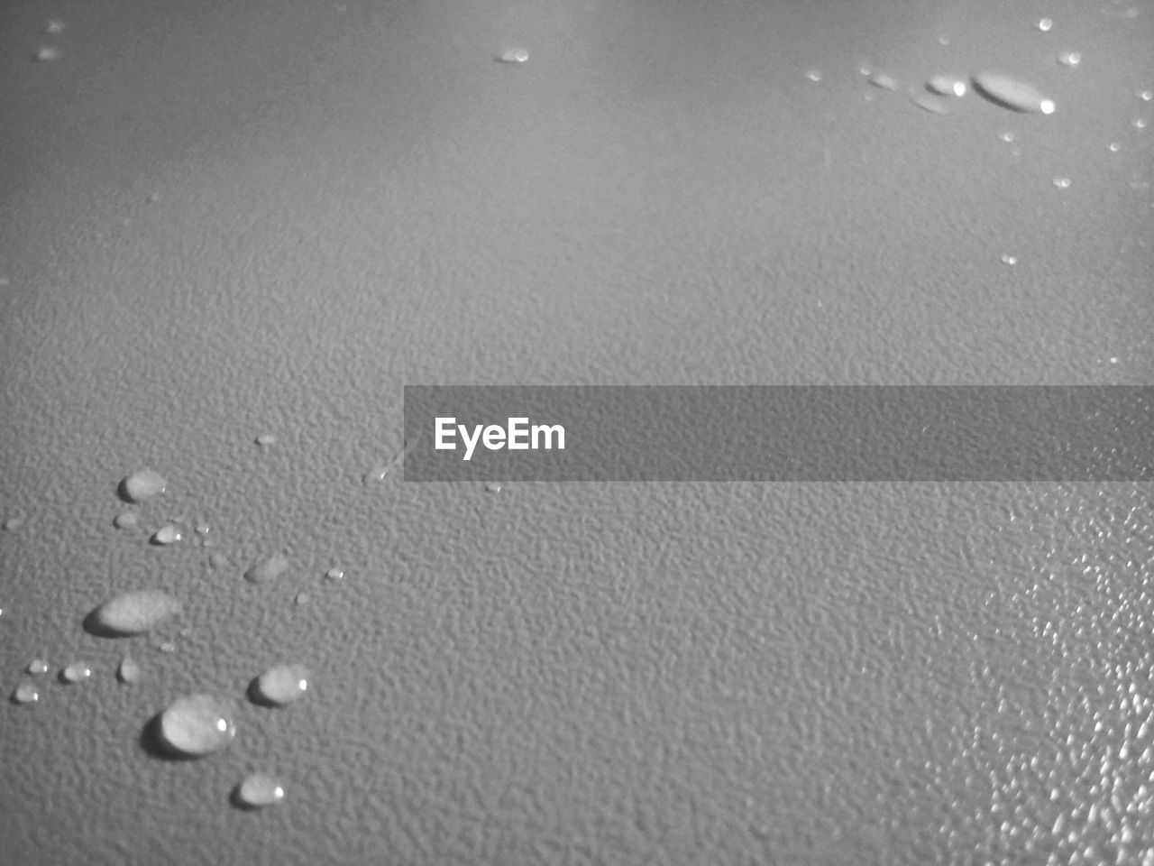 Close-up of water drops on table