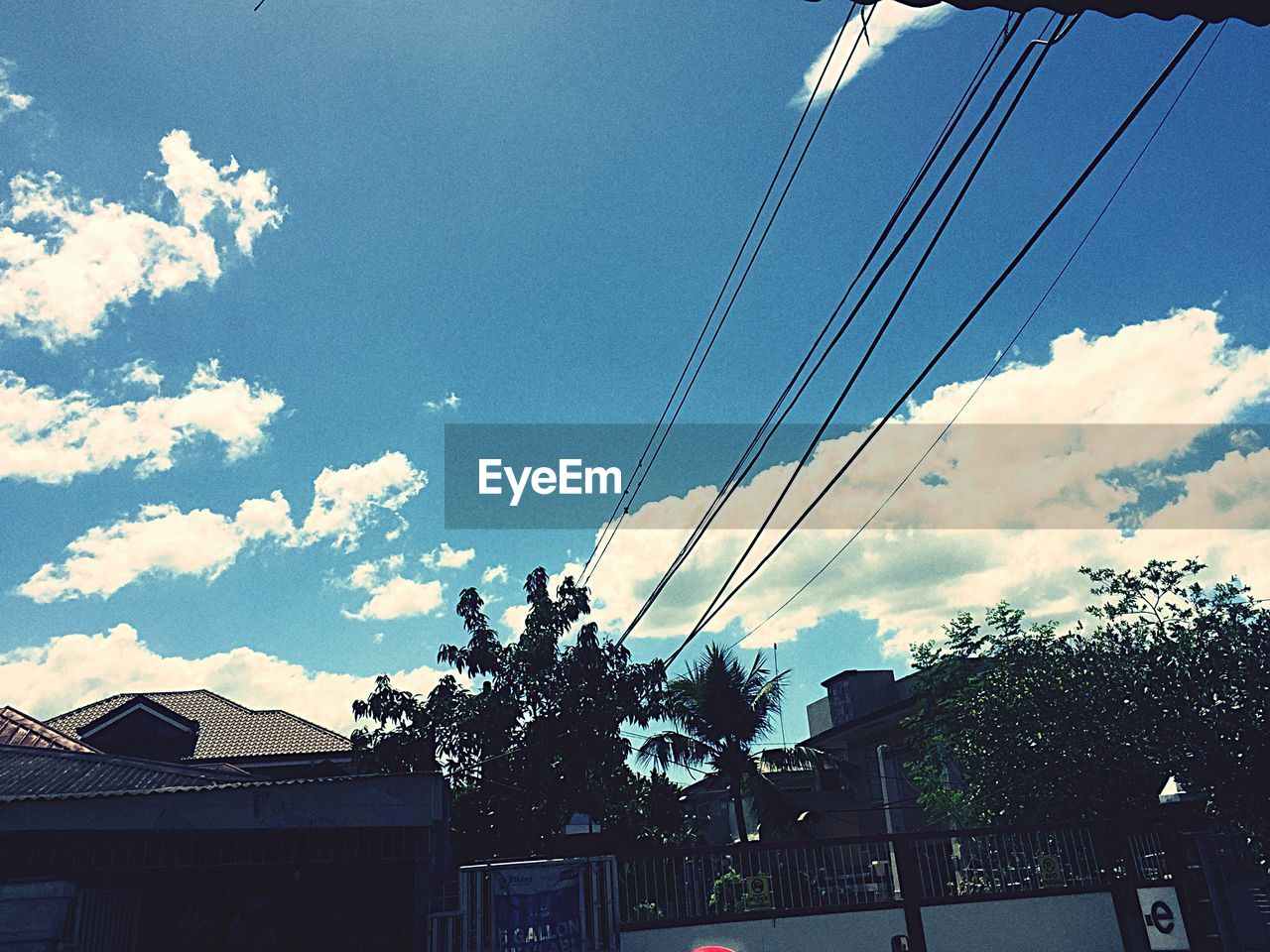 LOW ANGLE VIEW OF POWER LINES AGAINST SKY