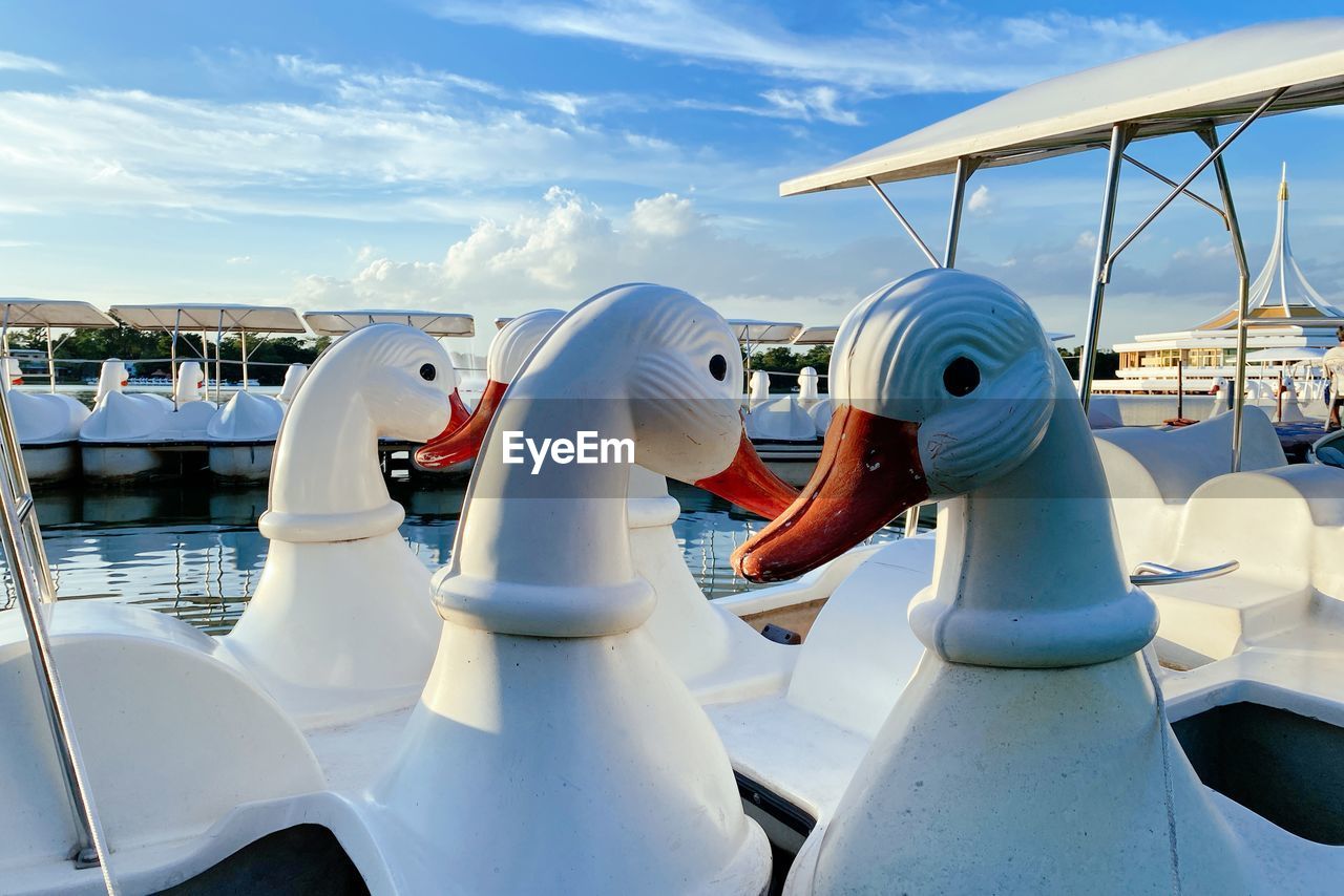 CLOSE-UP OF WHITE BOATS MOORED AT HARBOR