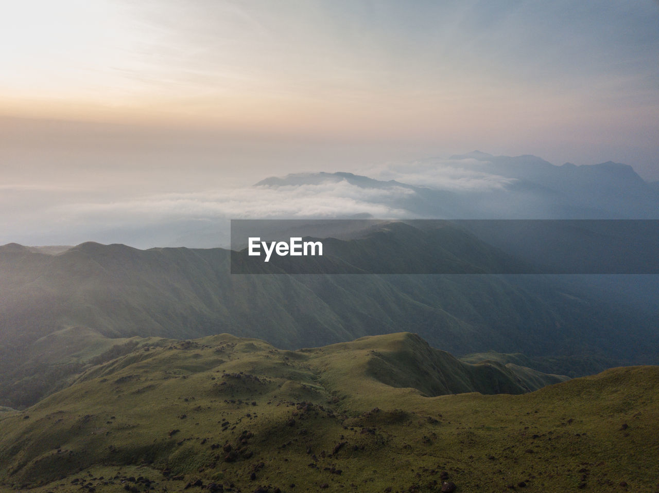 Scenic view of mountains against sky during sunset