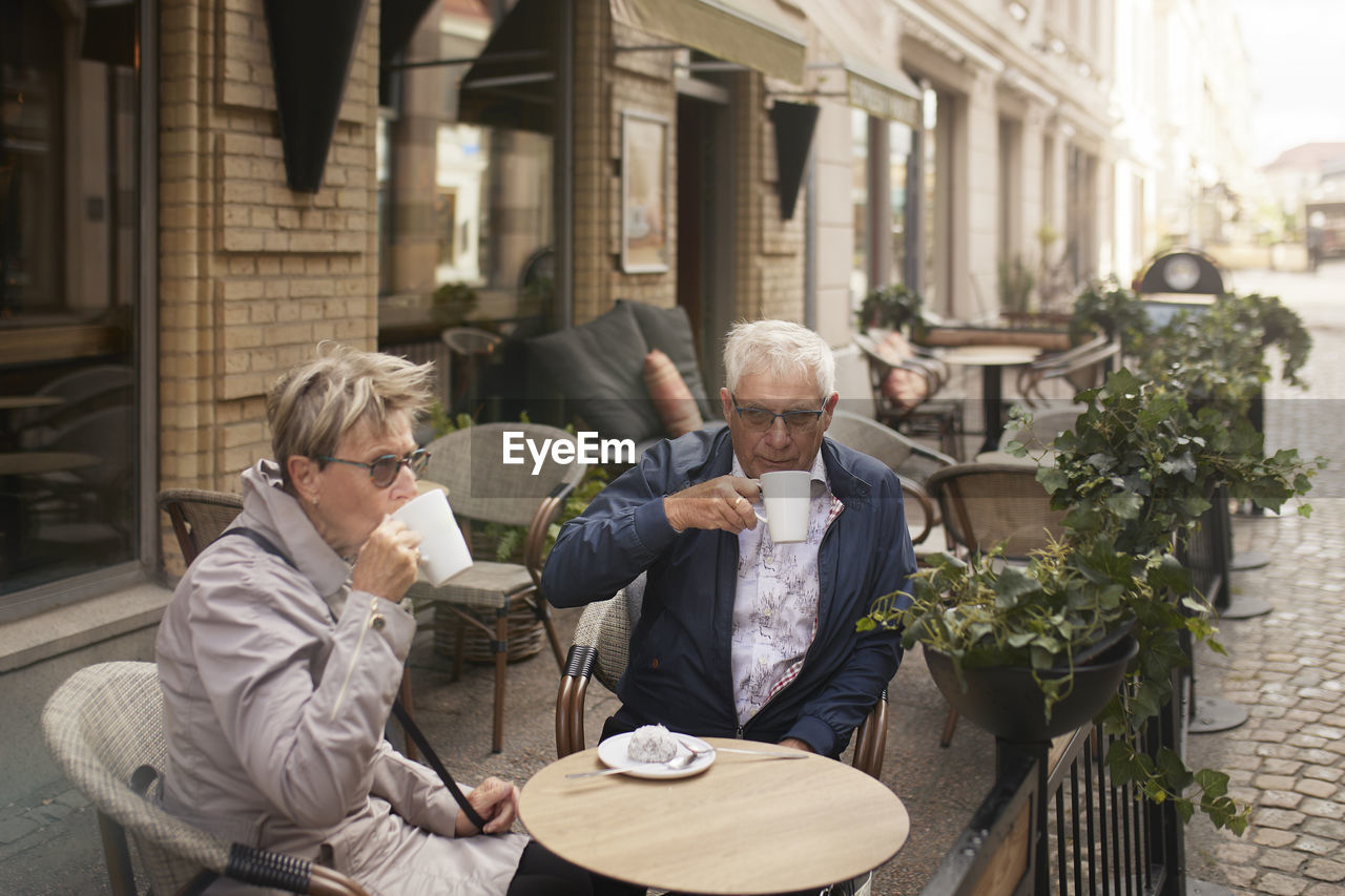 Mature couple having coffee