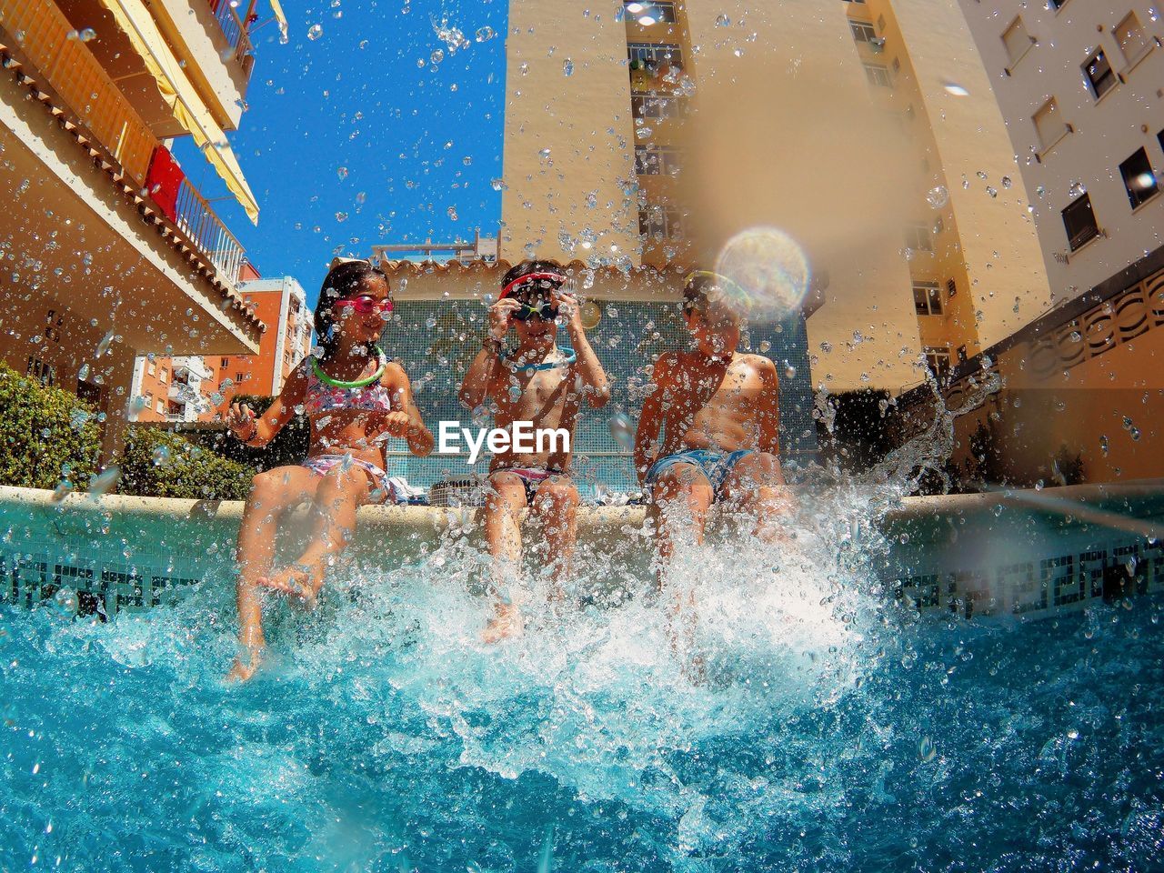 Children splashing in a swimming pool