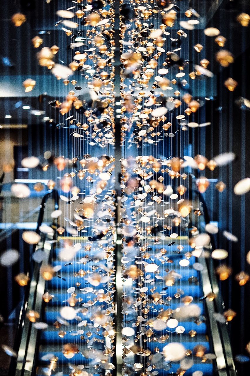 Glitter falling on escalator