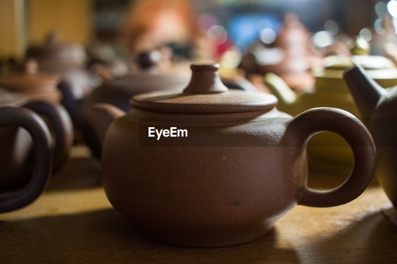 Close-up of teapot on table for sale in store