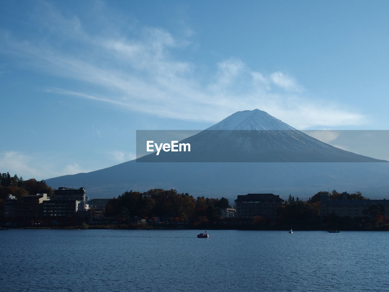 Scenic view of snowcapped mountain against cloudy sky