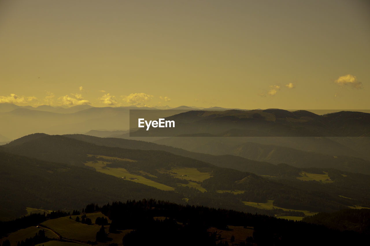 Scenic view of silhouette mountains against sky during sunset