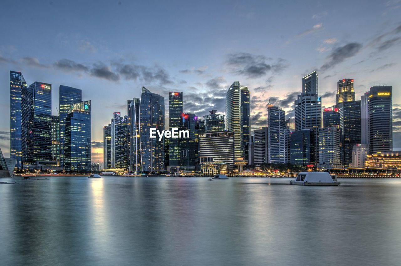 City skyline against cloudy sky