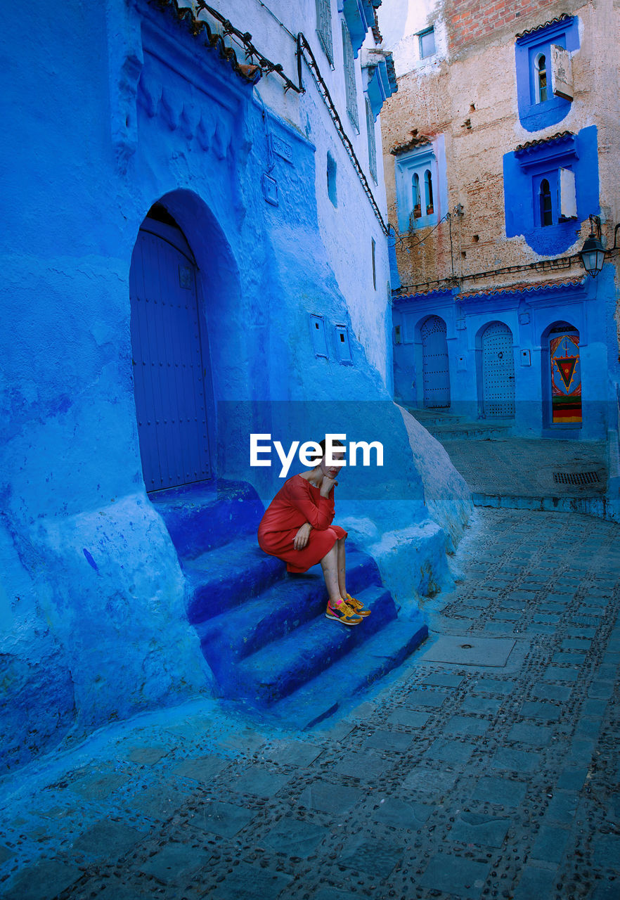 Woman with orange dress in chefchaouen