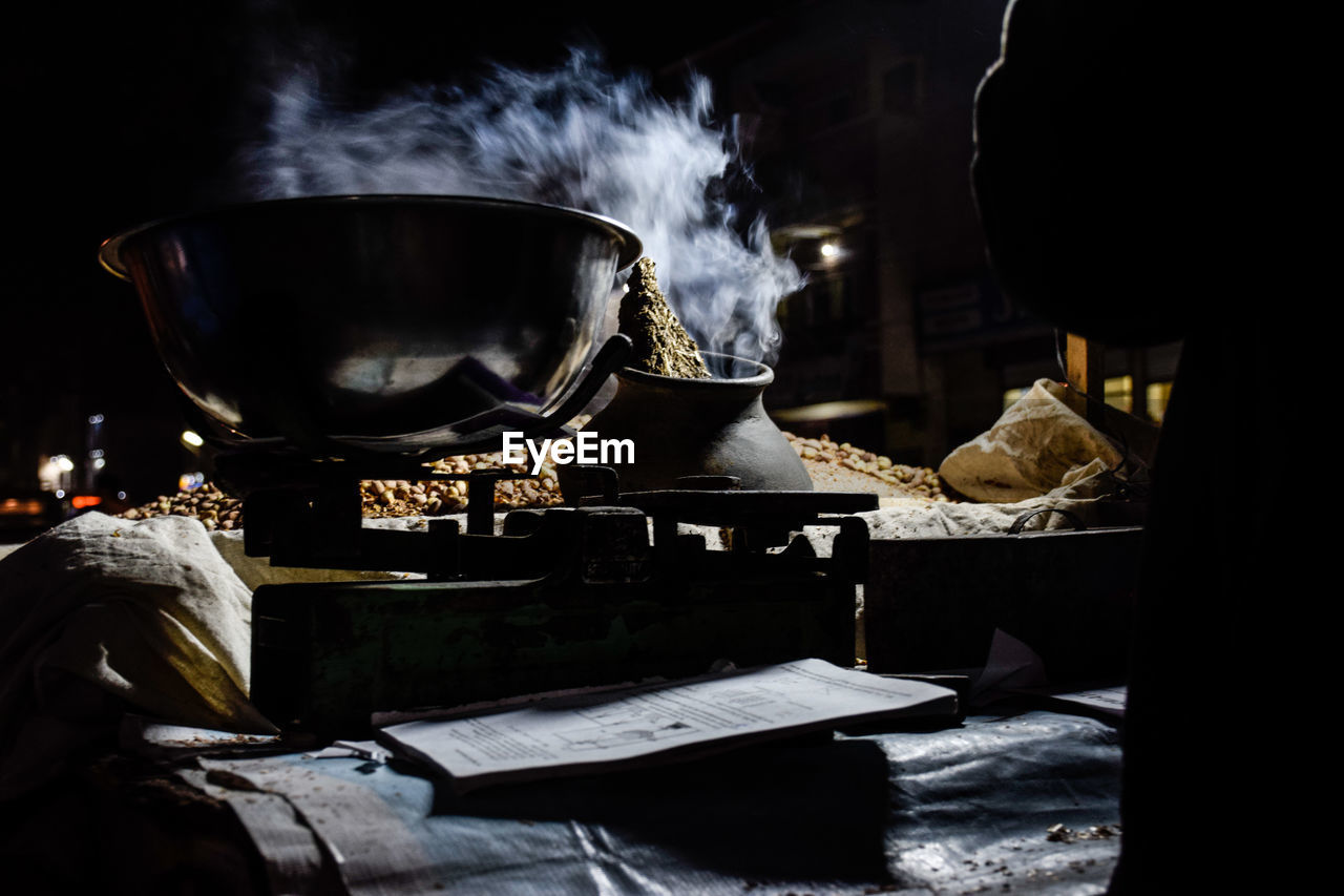 Close-up of smoke emitting from cooking utensil