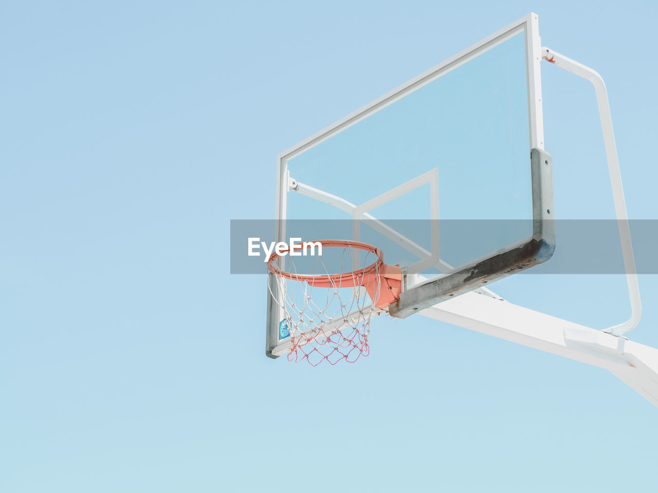 Low angle view of basketball hoop against sky