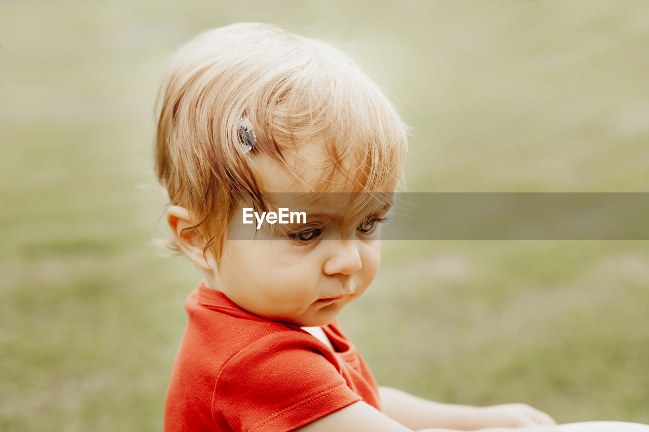 Close-up of cute baby looking away