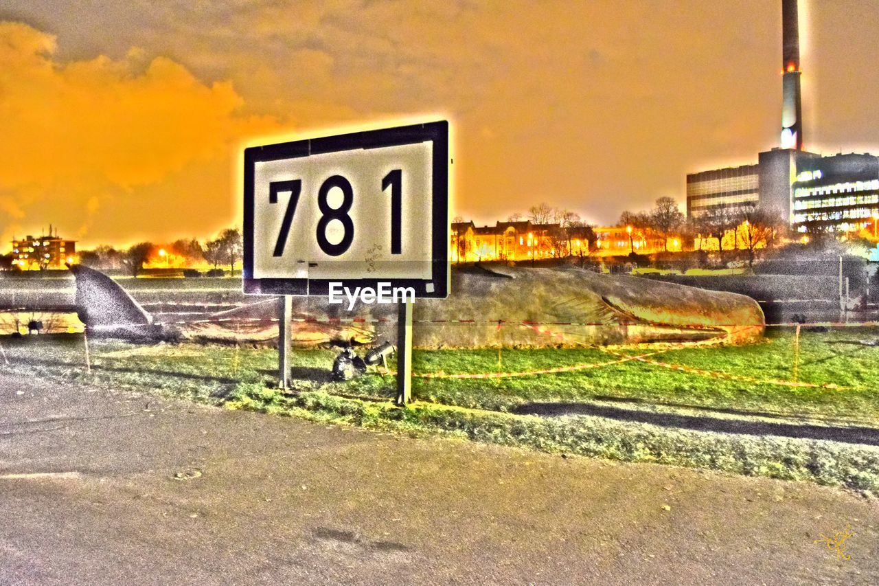 ROAD SIGN AGAINST SKY