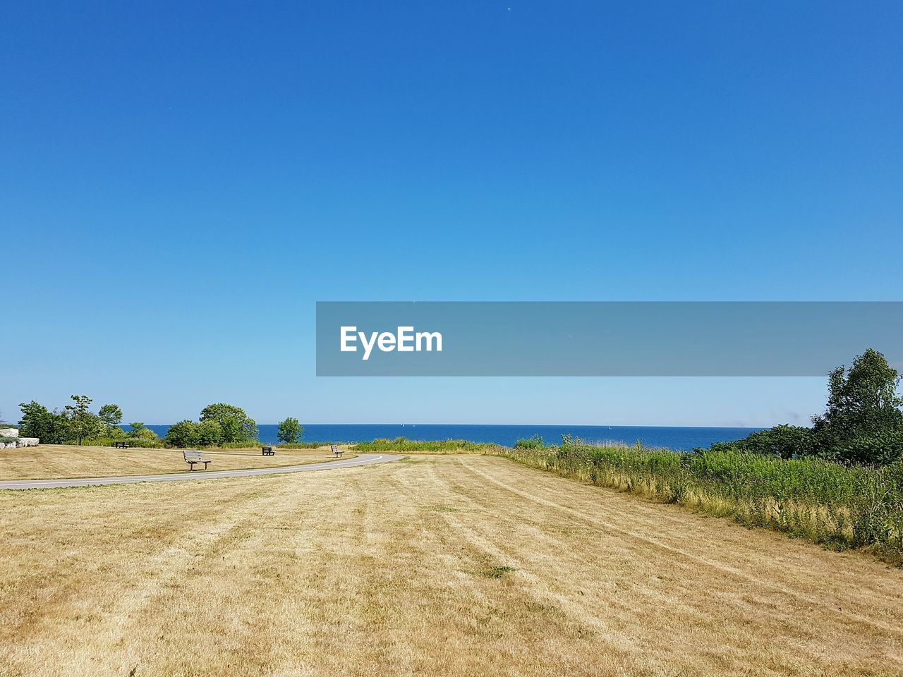 Scenic view of beach against clear sky