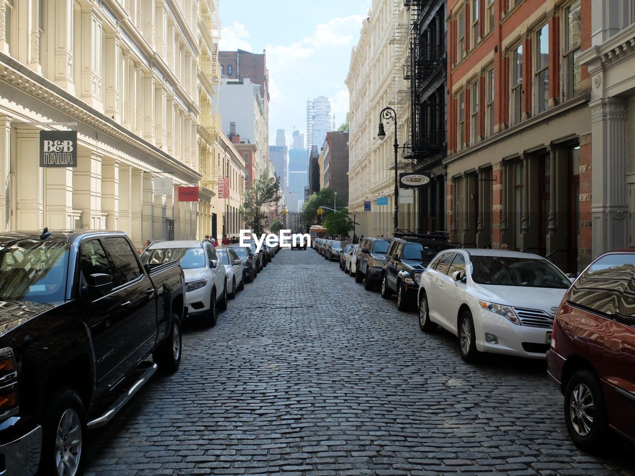 CARS PARKED ON STREET IN CITY