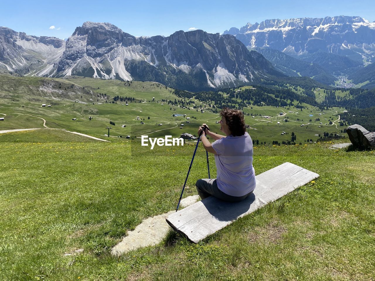 Rear view of woman on landscape against mountains