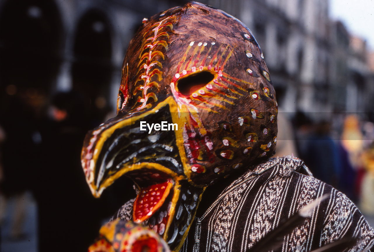 Close-up of person wearing bird mask during venice carnival