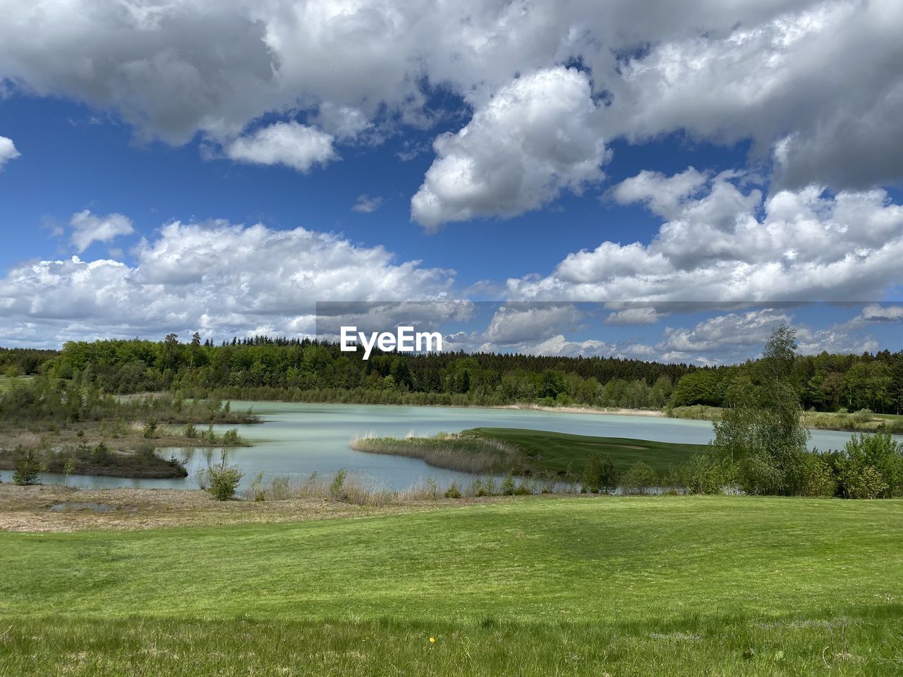 SCENIC VIEW OF GREEN LANDSCAPE AGAINST SKY