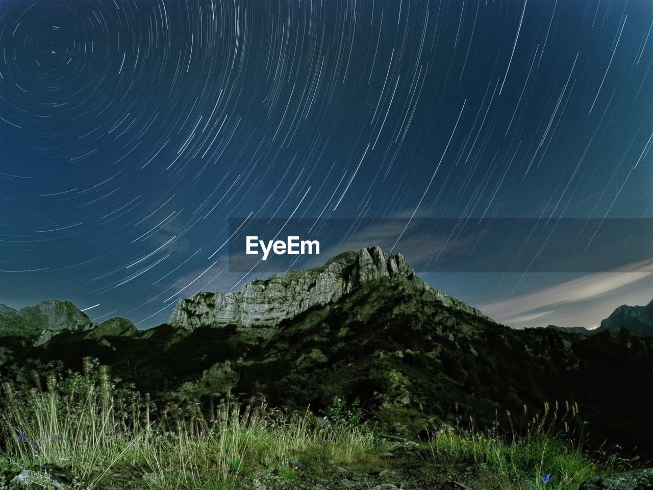 Scenic view of star field against sky at night, startrail