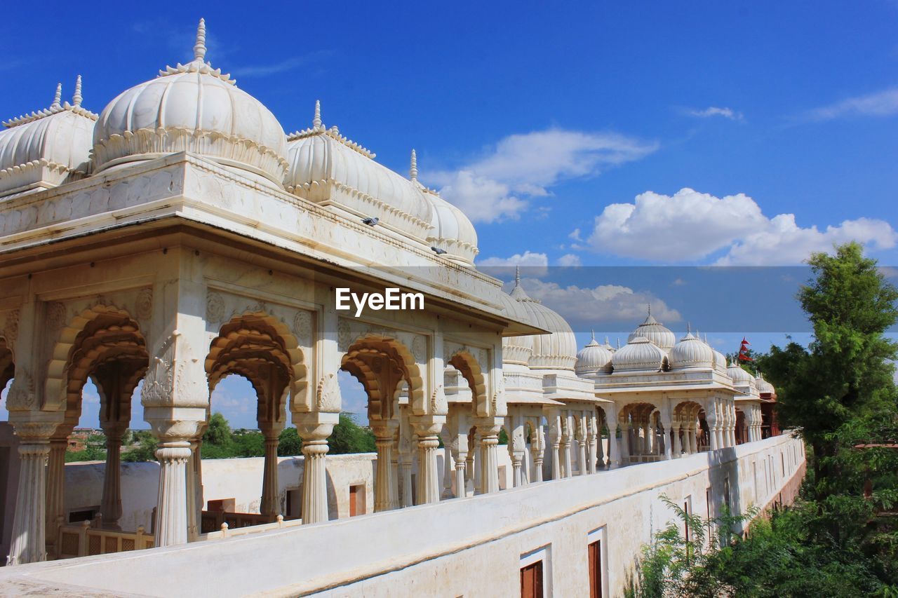 Historic buildings against sky during sunny day