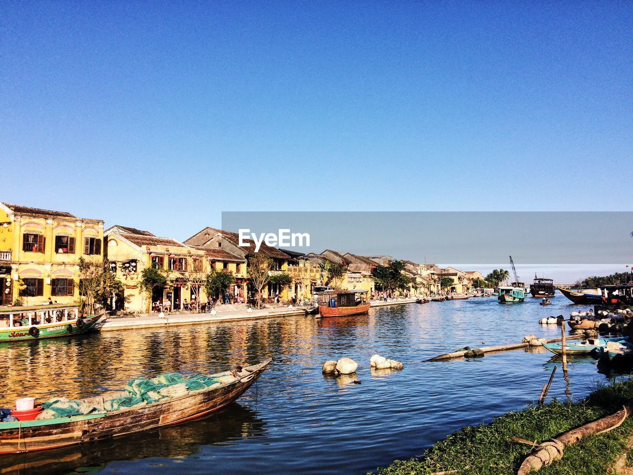 Boats moored at harbor